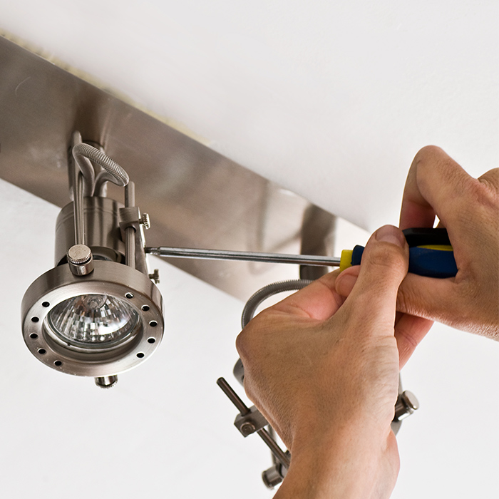 electrician-hand-close-up-with-screwdriver-repairing-lighting-fixture-auburn-ca