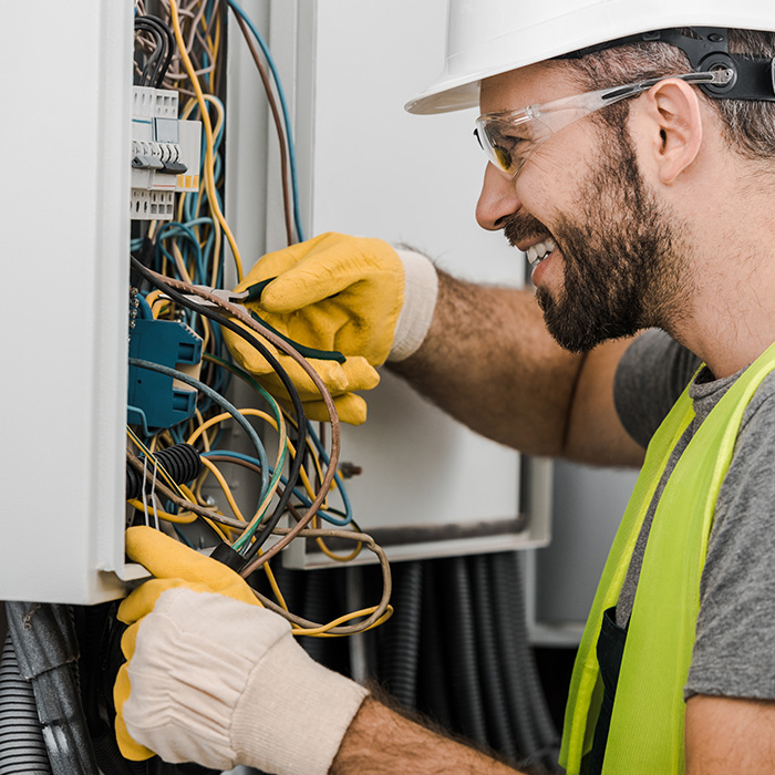electrician-with-protection-equipment-repairing-electrical-panel-auburn-ca