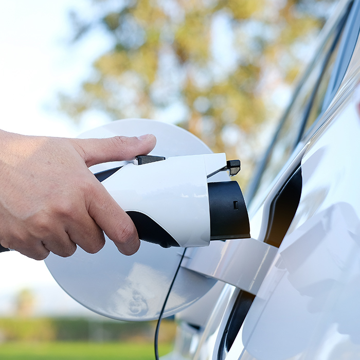 man-hand-close-up-installing-ev-charger-to-electric-car-close-up-auburn-ca